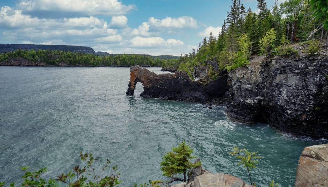 View across rough waves towards a rock formation known as the Sea Lion in Sleeping Giant Provincial Park. 