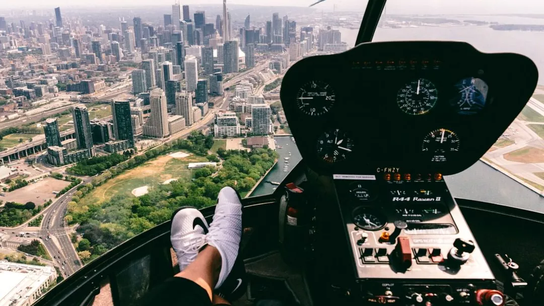 View of Toronto's skyline from the cockpit of a helicopter.