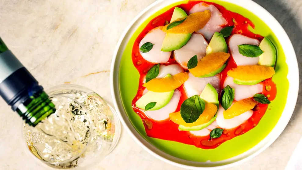 A colourful summer dish and drink being refilled at a popular Toronto restaurant.