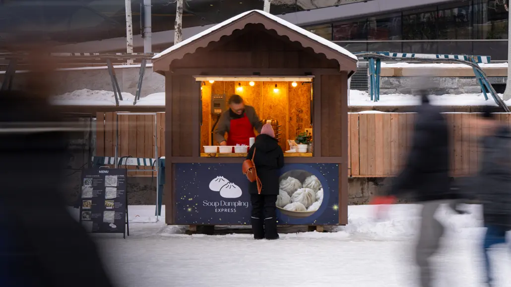 An inviting outdoor food vendor sells soup dumplings during the Winterlude winter festival in Ottawa.