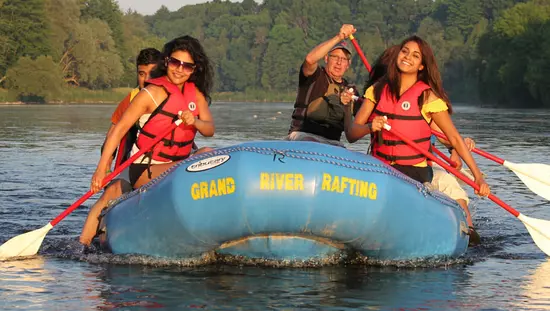 A group of people rafting down a scenic river