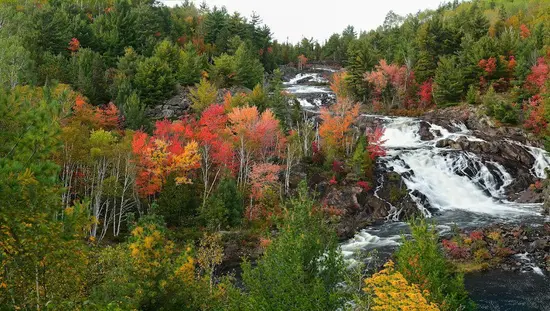 Waterfall surrounded by fall foliage