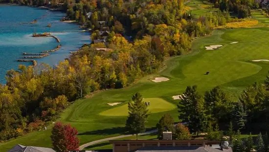 Aerial view of a Clubhouse, fairway and lake