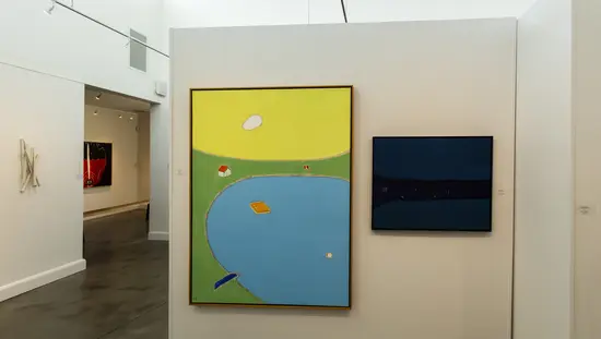 A painting hanging on the wall inside Oeno Gallery