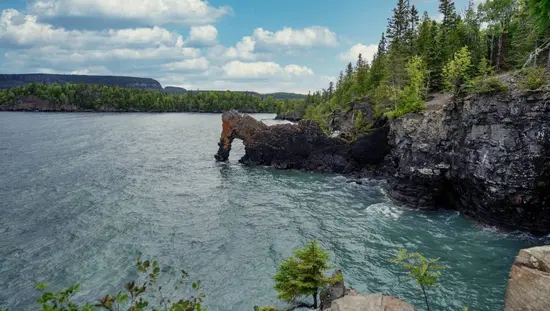 View across rough waves towards a rock formation known as the Sea Lion in Sleeping Giant Provincial Park. 