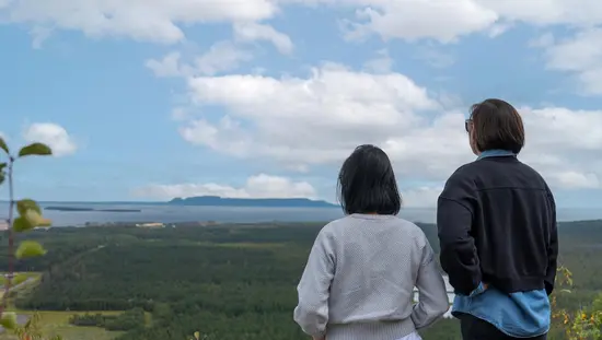 Two women watching the scenery from Mount McKay Lookout in Thunder Bay, Ontario.
