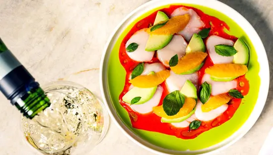 A colourful summer dish and drink being refilled at a popular Toronto restaurant.