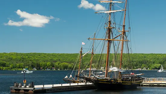 A tall ship is docked at Discovery Harbour.