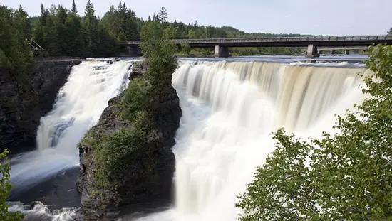 Majestic waterfalls below a trail and viewing platform in Northern Ontario.