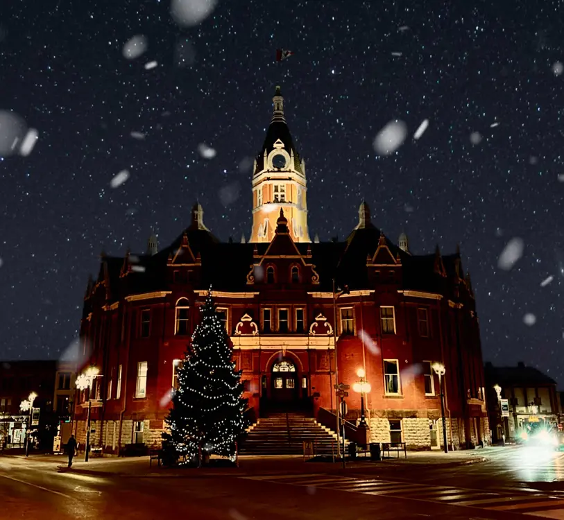 City Hall building in Stratford Ontario lit up in winter.