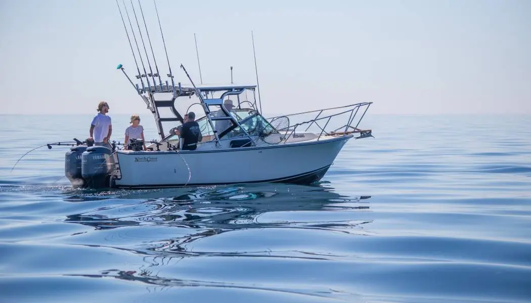 A group of anglers enjoys a summer day fishing on Lake Ontario with a local charter boat. 