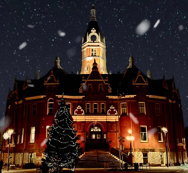 City Hall building in Stratford Ontario lit up in winter.