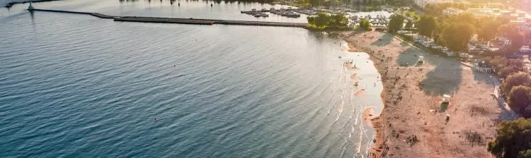 An aerial view of the Cobourg Beach in summer.