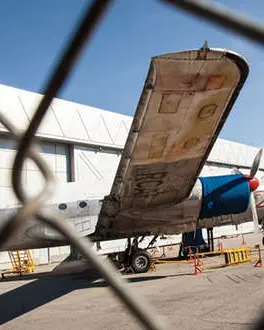 An RCAF plane is displayed in front of a hangar