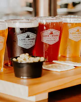 A beer flight containing four varierties of beer and accompaniments from the Lake of the Woods Brewing Company.