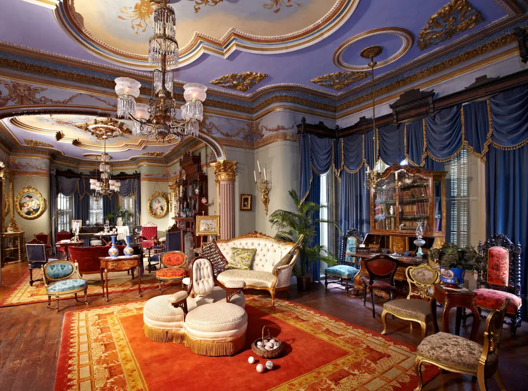 Drawing rooms of historic mansion with vintage furniture and draperies and chandeliers 