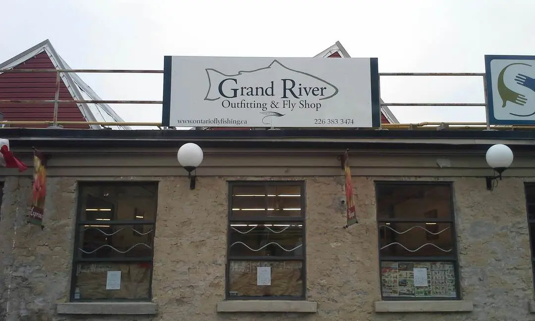 Front view of shop with old stone walls and row of 3 large upper windows