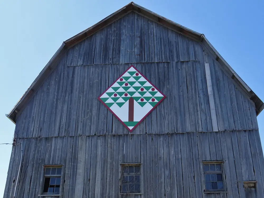 Folk art adorns the front of an old barn