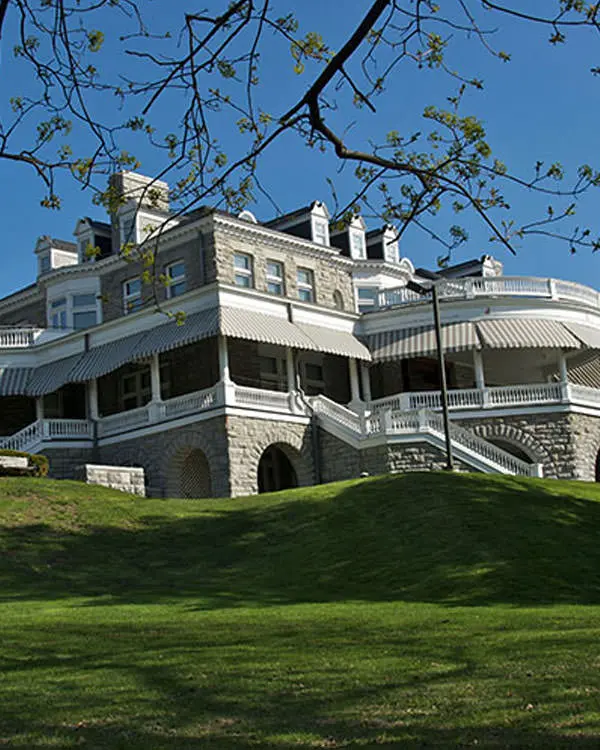 A stunning white mansion on a hill