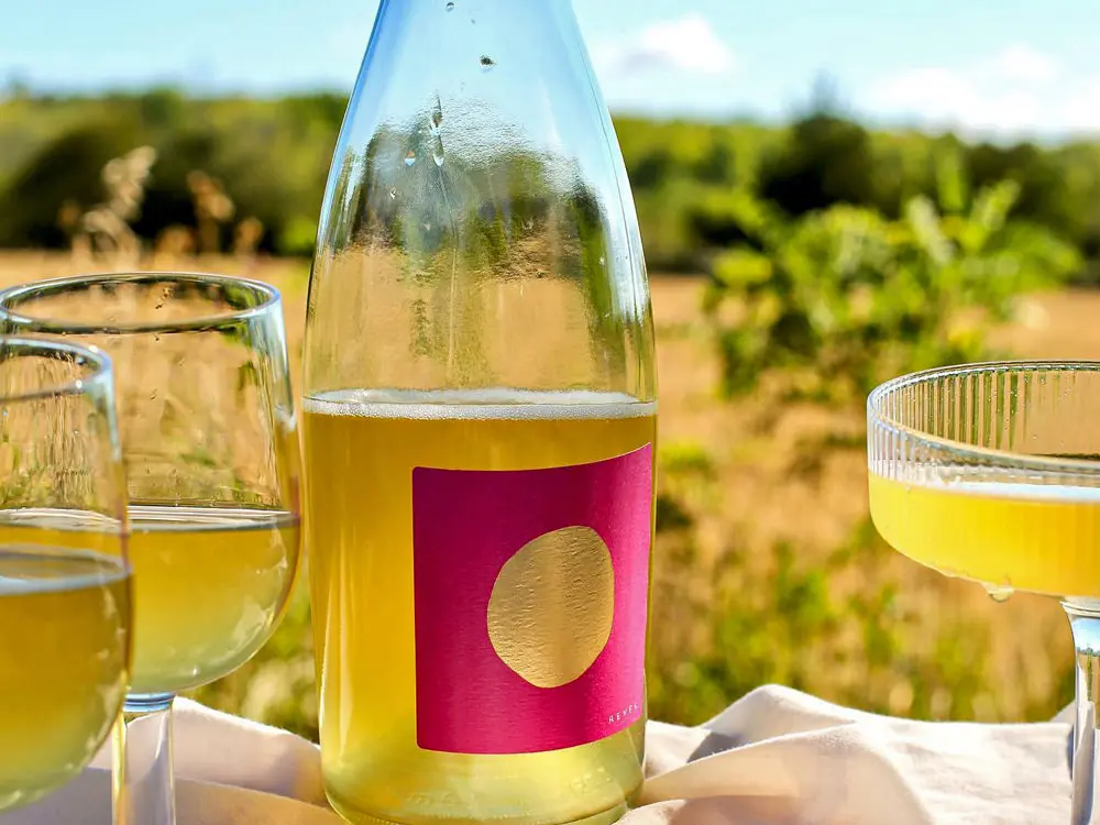 A bottle and glasses of delicious local cider 