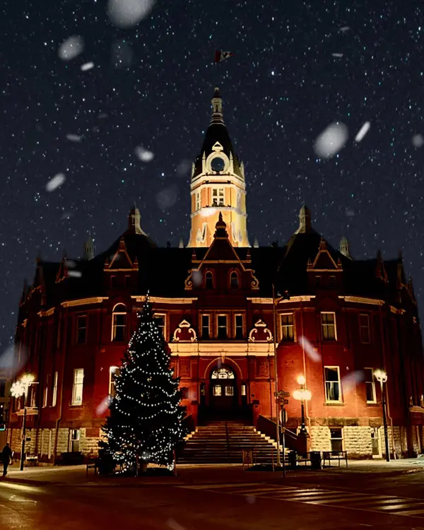 City Hall building in Stratford Ontario lit up in winter.