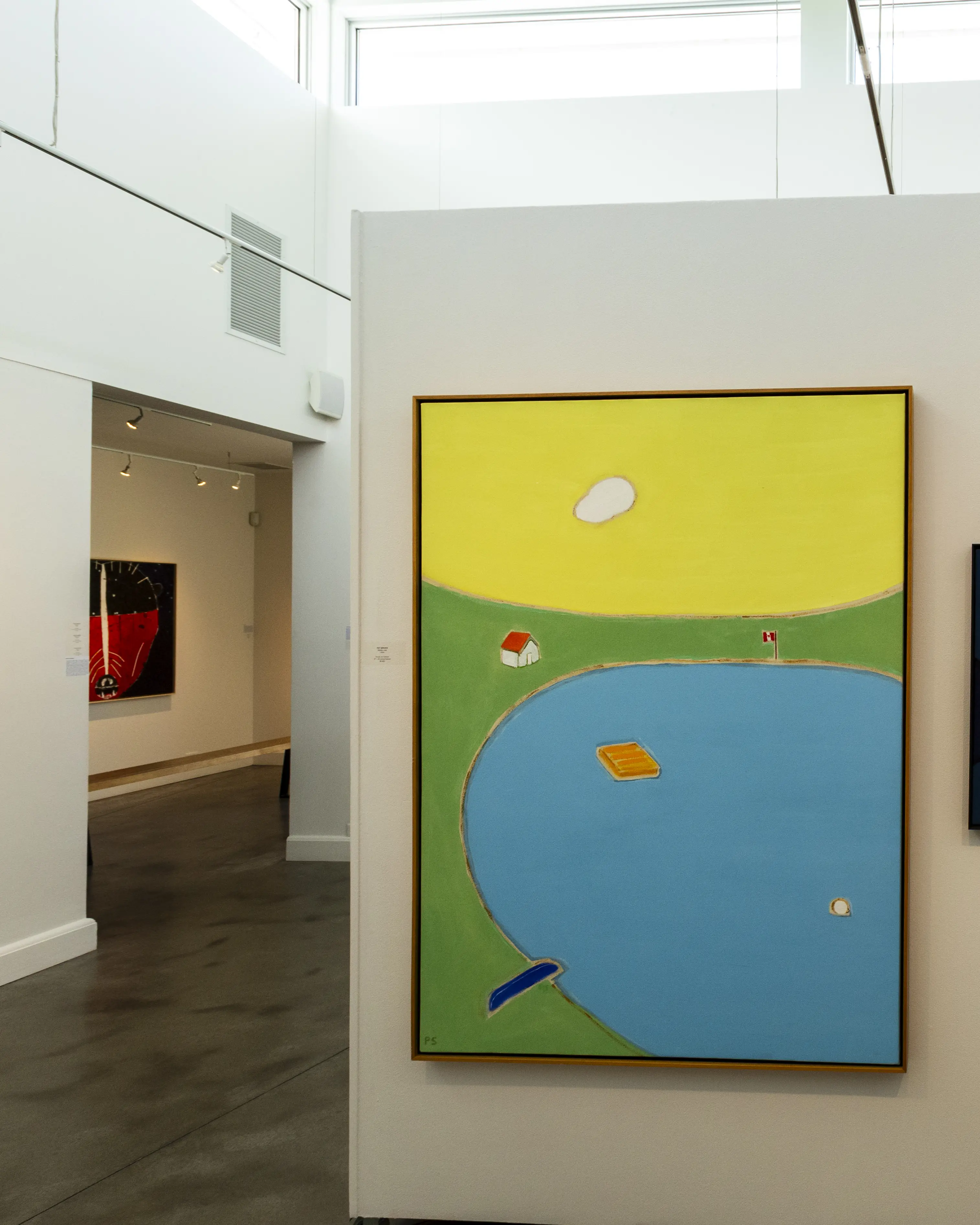 A painting hanging on the wall inside Oeno Gallery