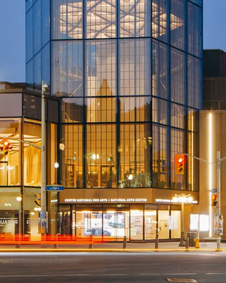 The National Arts Centre in Ottawa lit up at night.