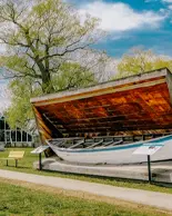 A canoe displayed alongside a stone path at Nancy Island Historic Site.