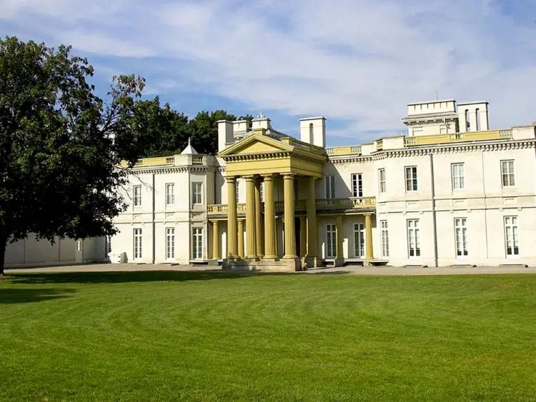 A view of the formal entrance of a historic mansion.