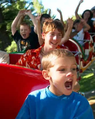 Kids riding a roller coaster at Santa’s Village in Bracebridge.