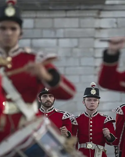 Costumed soldiers reenact a military drill at Fort Henry National Historical Site in Kingston.