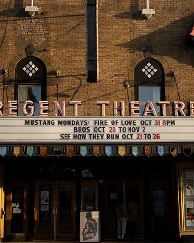 The front of a historic theatre with original marquee in Prince Edward County.