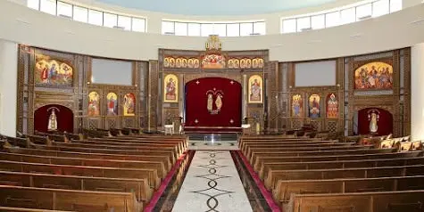 Interior view of church with pews and artwork