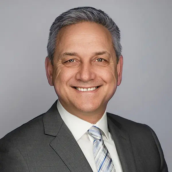 Headshot of Jerry Pribil, smiling and wearing a suit.