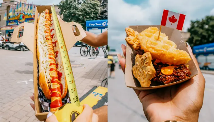 Un perrito caliente extralargo que se está midiendo con una cinta métrica y una bandeja de aperitivos fritos coronada con una pequeña bandera canadiense.