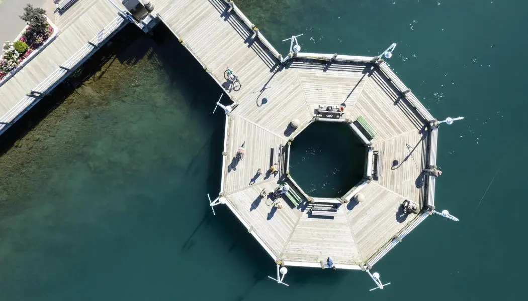 Aerial view of an octagonal wooden boardwalk viewing platform along the St. Marys River in downtown Sault. Ste. Marie.