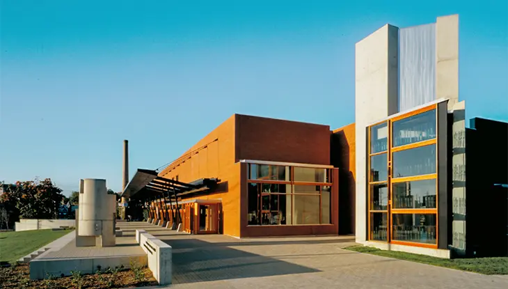 The Canadian Clay and Glass Gallery with angular architecture and a sculpture in front.