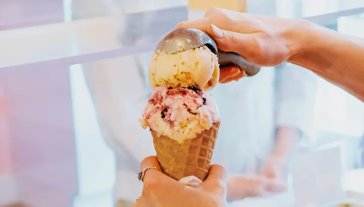 A person waiting for an ice cream cone at Four All Ice Cream.