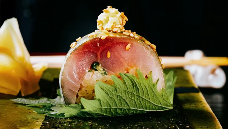 Close-up view of a sashimi roll at Kappo Sato, a MICHELIN starred restaurant in Toronto.