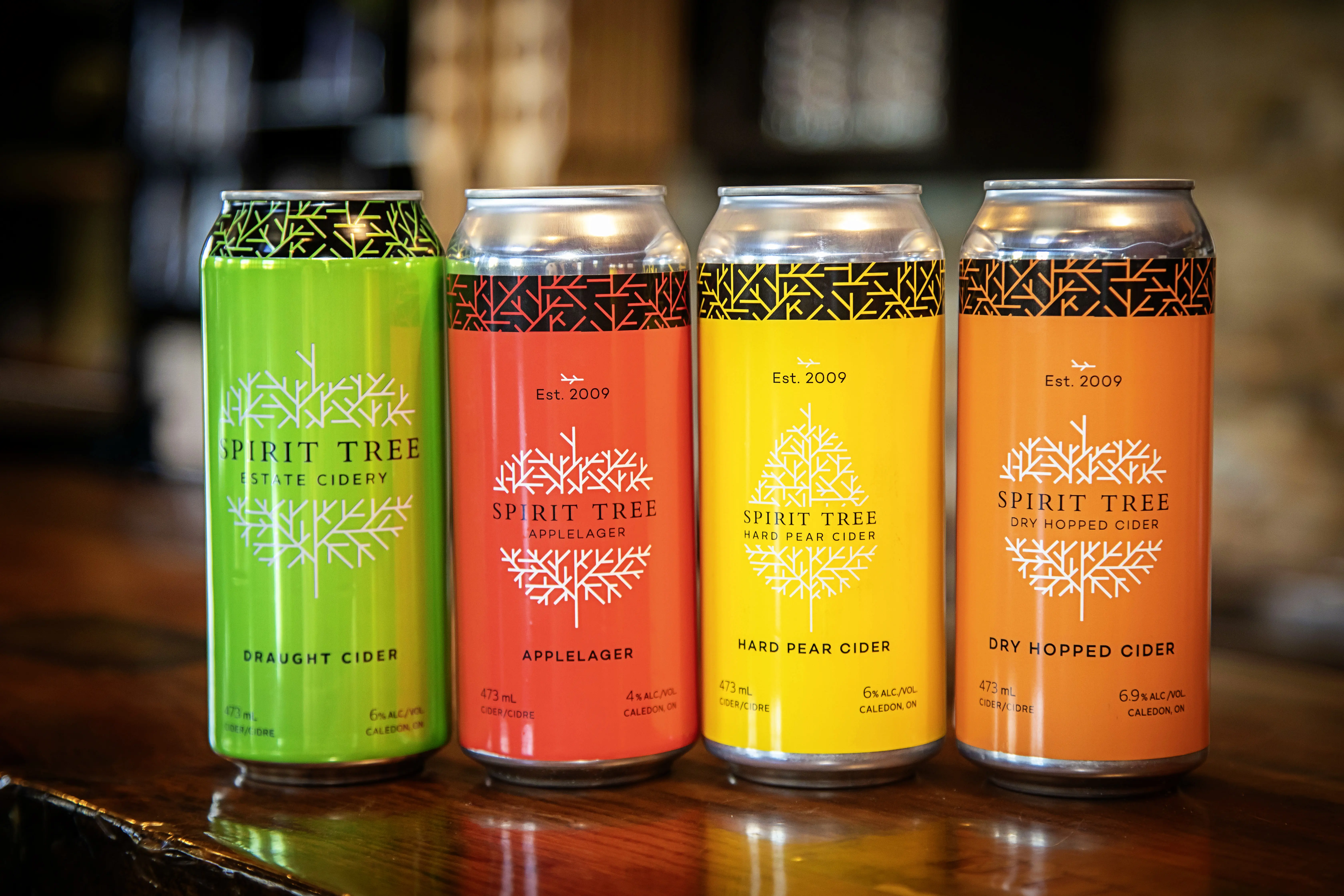 Cuatro latas de sidra Spirit Tree.