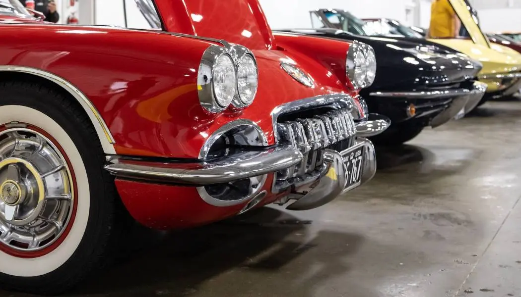 A row of well-maintained vintage cars on display at an Ontario summer car show.