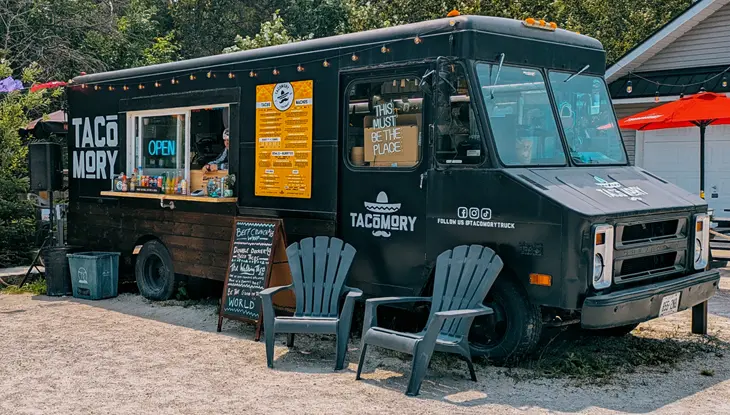Exterior of the black, TACOMORY food truck.