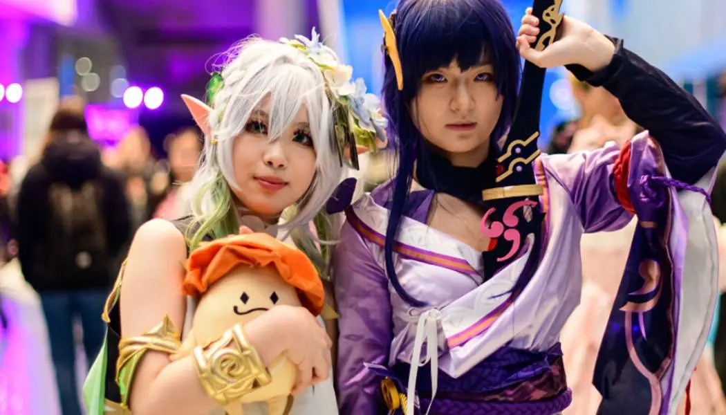 Two women enjoy cosplay at the Fan Expo Canada in Toronto.